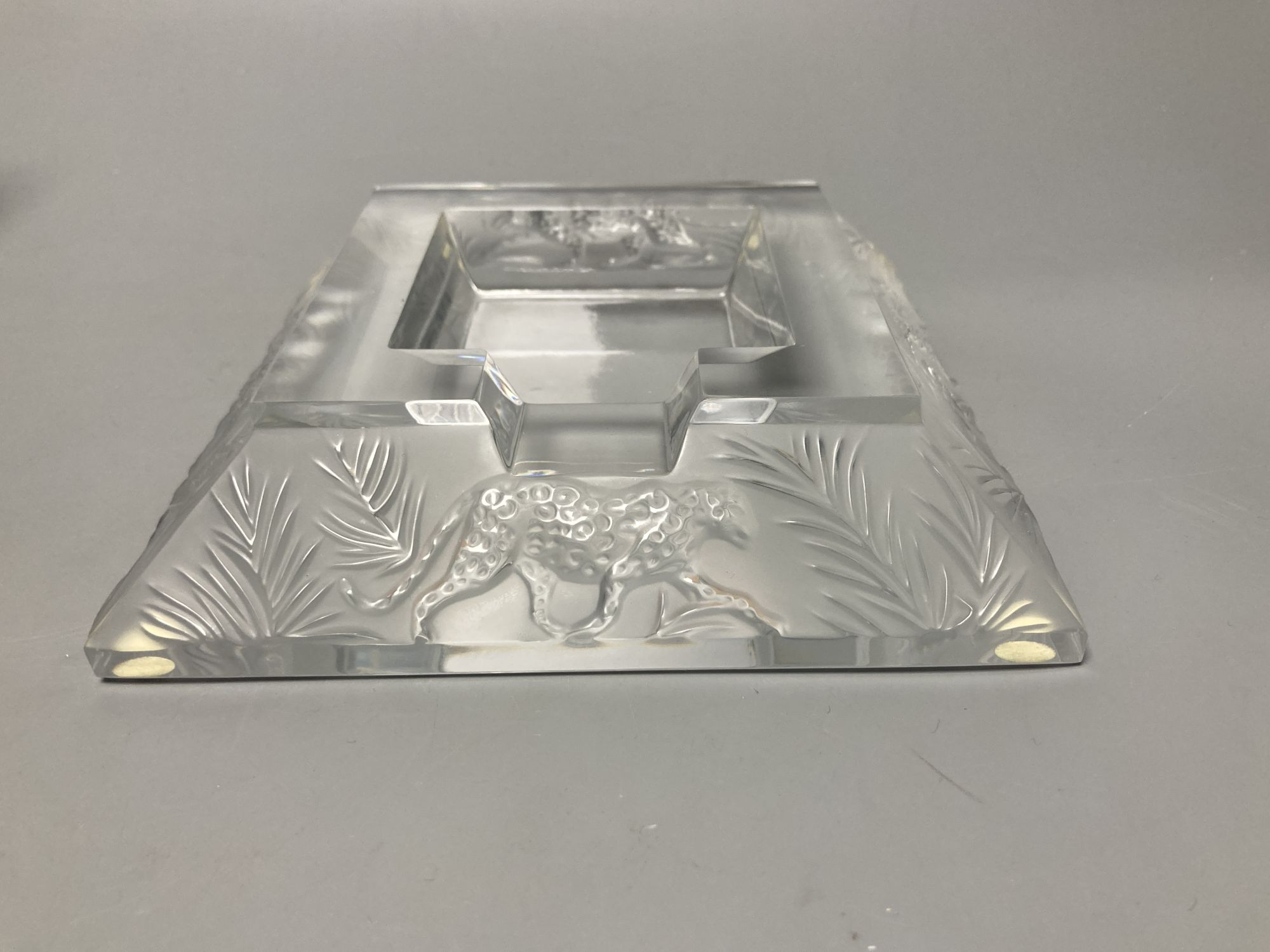 A Lalique R. France frosted glass 'leopard' ashtray, 16.5cm sq.
